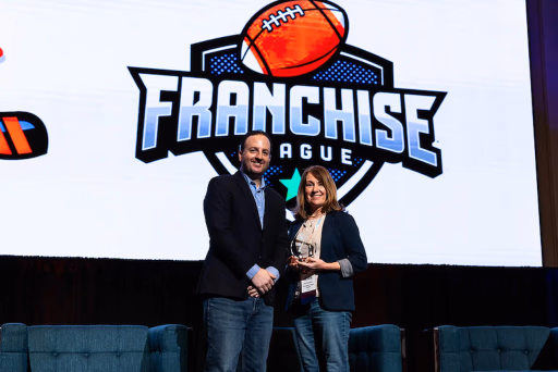The Franchise League Football team accepting an award from the Fantasy Sports & Gaming Association.